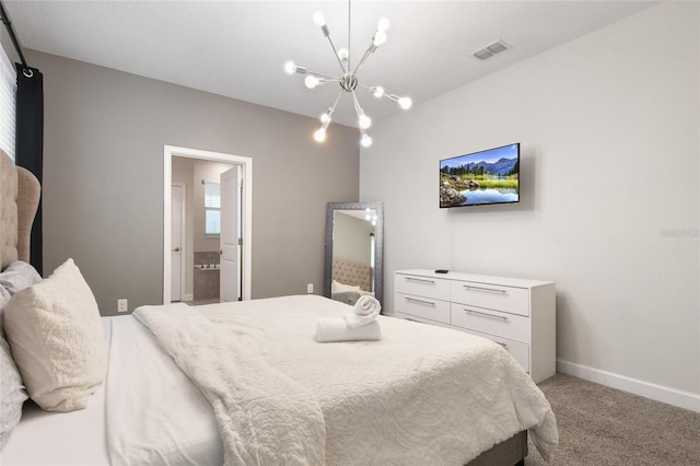 carpeted bedroom with an inviting chandelier and ensuite bath