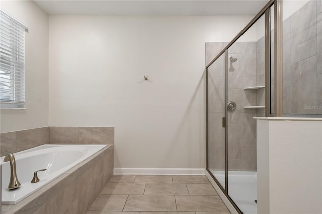 bathroom featuring separate shower and tub and tile patterned floors