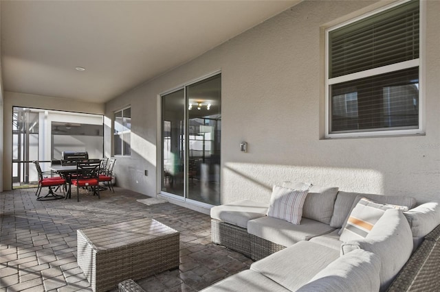 view of patio with area for grilling and an outdoor hangout area