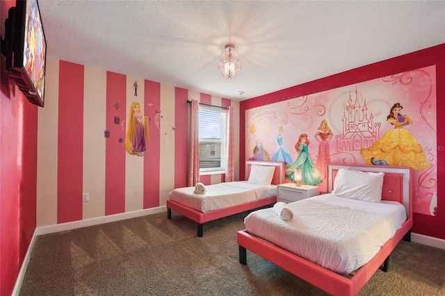 bedroom featuring a textured ceiling and carpet floors