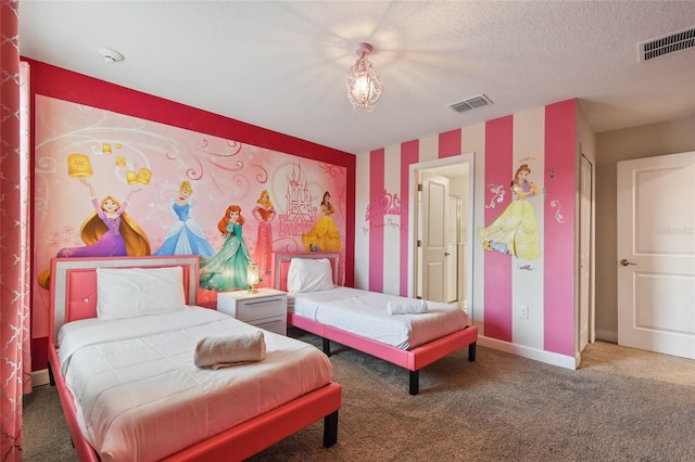 carpeted bedroom with a textured ceiling