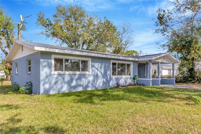 ranch-style home featuring a front yard