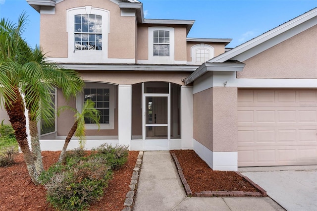 doorway to property featuring a garage