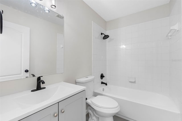 full bathroom with vanity, toilet, and tiled shower / bath