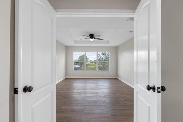 empty room featuring ceiling fan and dark hardwood / wood-style flooring