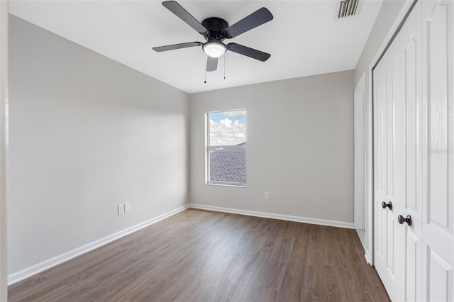 unfurnished bedroom featuring hardwood / wood-style floors and ceiling fan