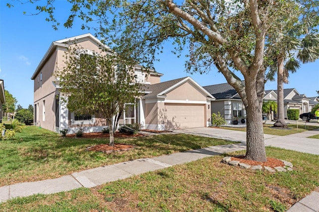 view of front facade featuring a garage and a front lawn