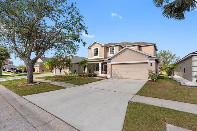 traditional-style home featuring driveway, a front lawn, an attached garage, and stucco siding