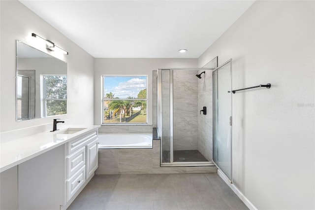 full bath featuring a garden tub, a shower stall, and vanity