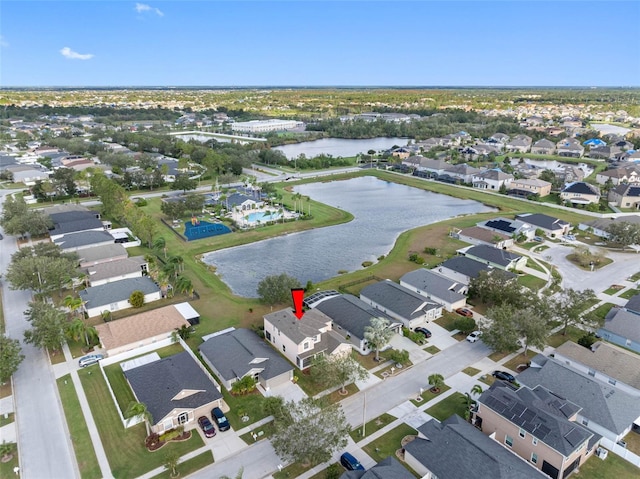 birds eye view of property featuring a water view and a residential view