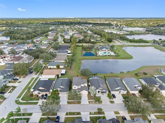 birds eye view of property featuring a water view and a residential view