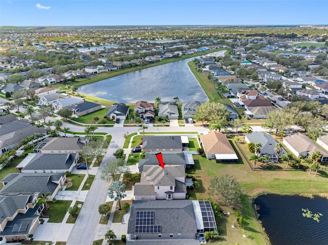 aerial view with a water view and a residential view