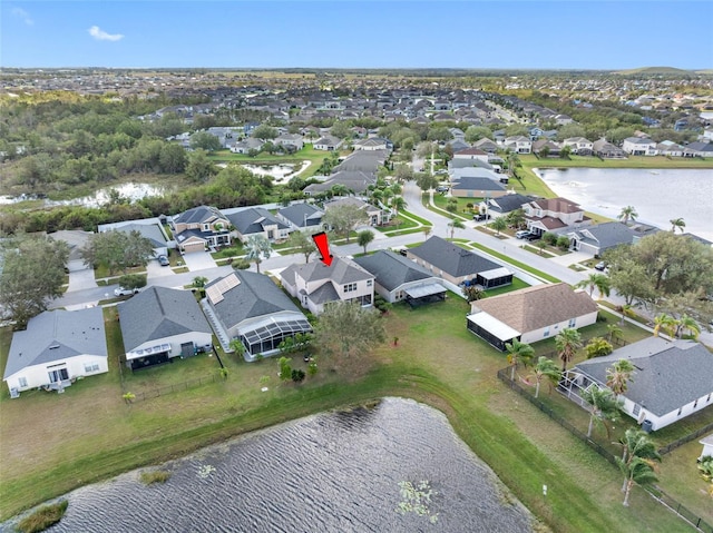 birds eye view of property featuring a residential view and a water view