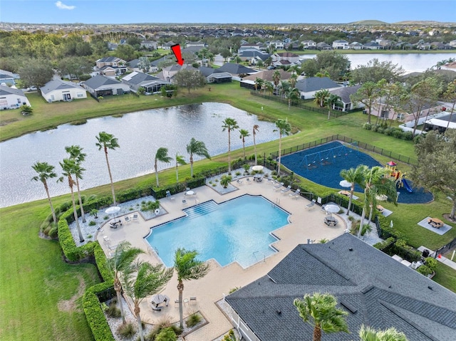 birds eye view of property featuring a water view and a residential view