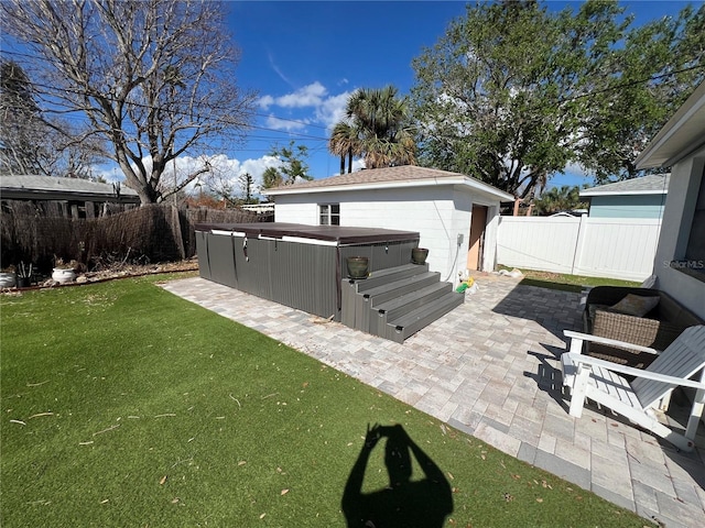 507 79th Ave, St Pete Beach, FL 33706 - fenced backyard with a hot tub and a patio