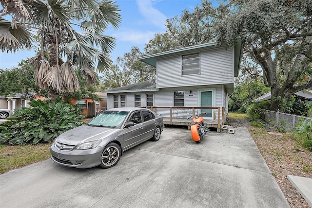 view of front of property with a wooden deck