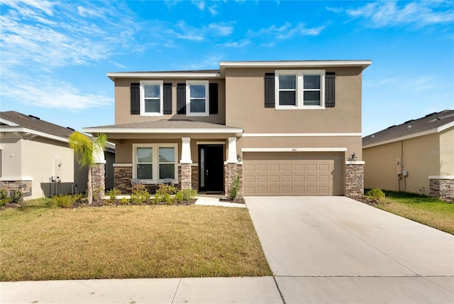 view of front of property featuring a garage and a front lawn