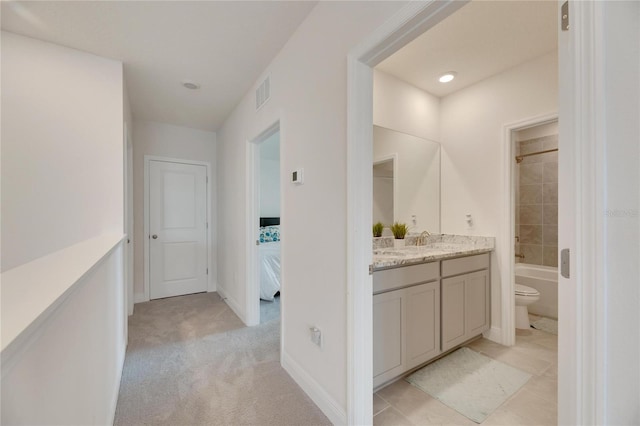 full bathroom with tile patterned floors, vanity, toilet, and tiled shower / bath