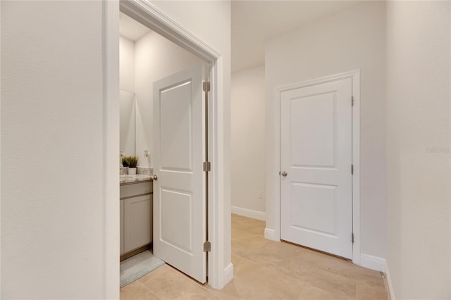 hallway with light tile patterned floors