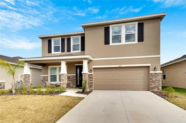 view of front facade with a garage and a front lawn