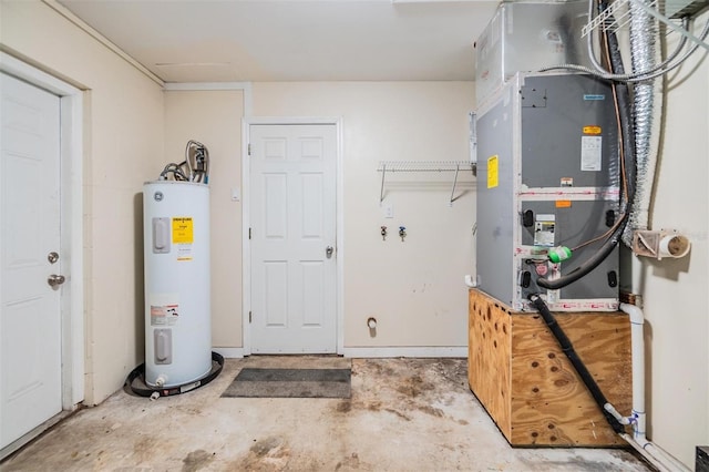 utility room featuring heating unit and electric water heater