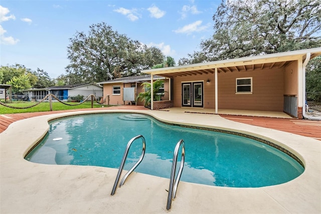 view of pool with a patio and a deck