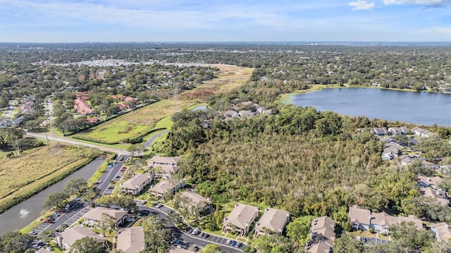 birds eye view of property with a residential view and a water view