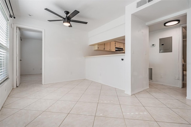 unfurnished living room featuring electric panel, visible vents, ceiling fan, and light tile patterned flooring