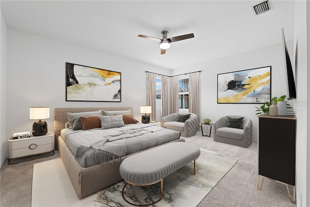 bedroom featuring ceiling fan and light colored carpet