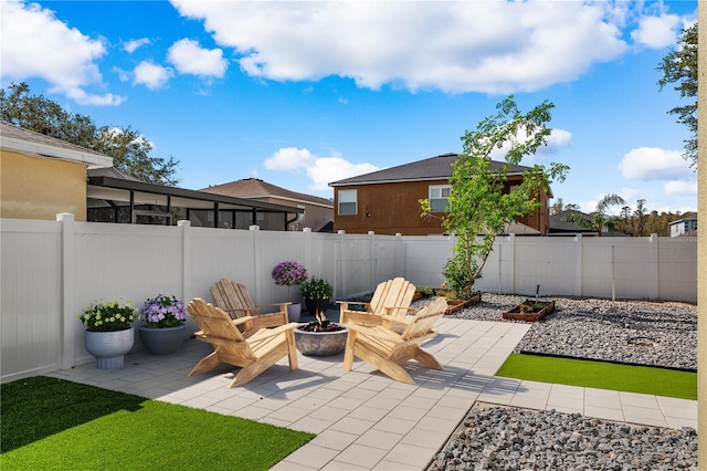 view of patio with a fire pit