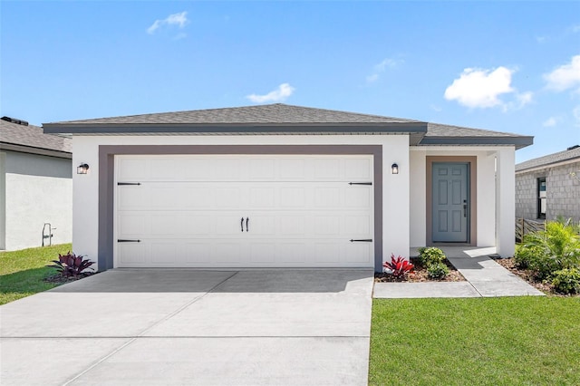 single story home featuring a front yard and a garage