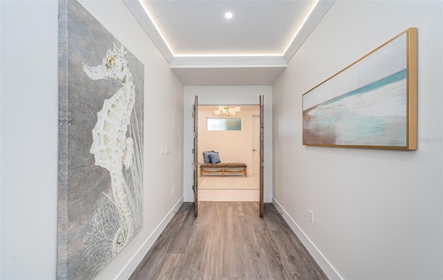 corridor featuring hardwood / wood-style floors