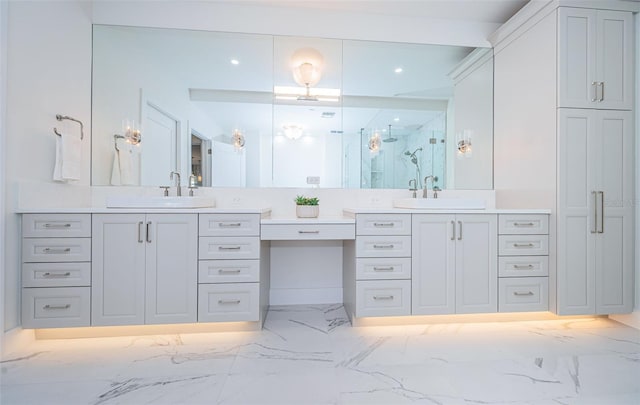 bathroom with vanity and a shower with shower door