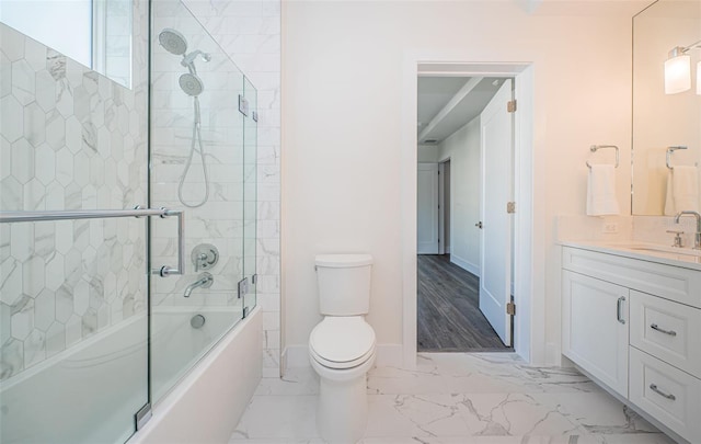 full bathroom featuring wood-type flooring, vanity, toilet, and enclosed tub / shower combo