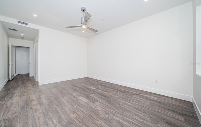 spare room featuring hardwood / wood-style flooring and ceiling fan