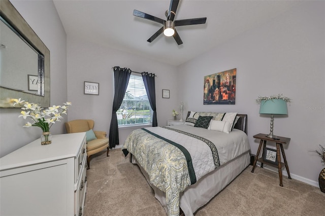 bedroom with ceiling fan and light carpet