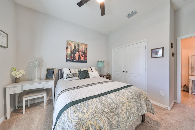 carpeted bedroom featuring a closet and ceiling fan