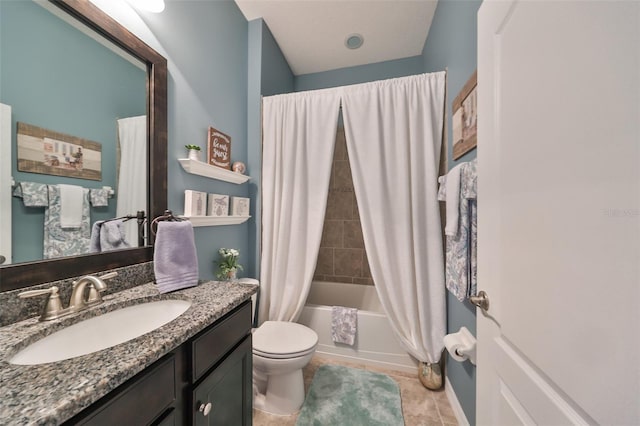 full bathroom featuring tile patterned flooring, shower / tub combo, vanity, and toilet