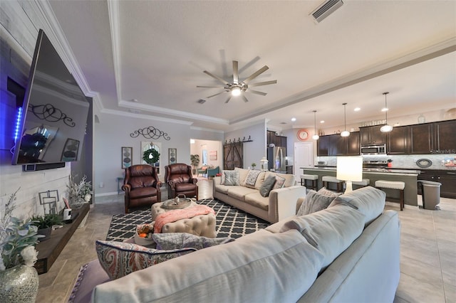 tiled living room featuring ceiling fan and crown molding