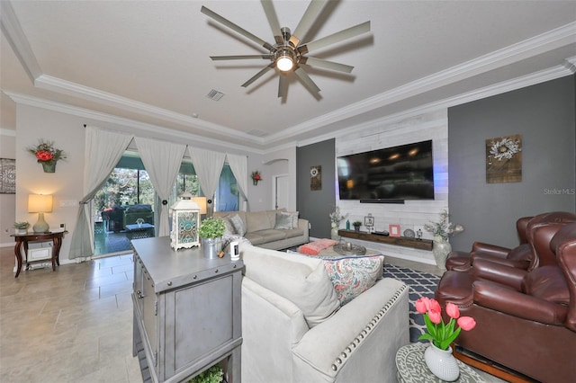 living room with ceiling fan and crown molding