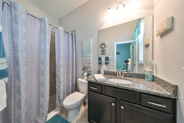 bathroom featuring tile patterned flooring, vanity, curtained shower, and toilet