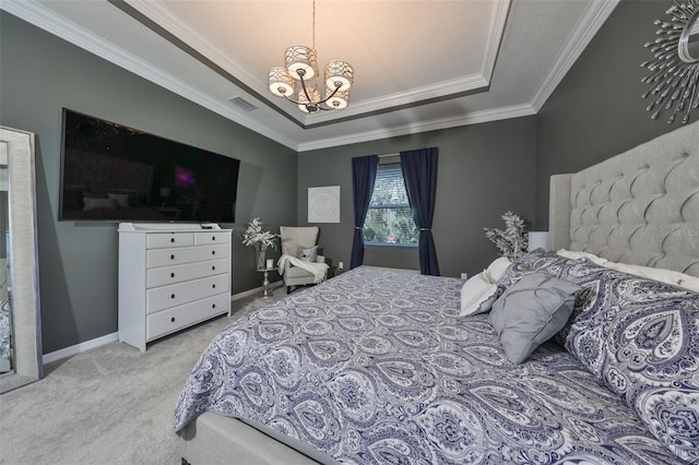 bedroom with a raised ceiling, light colored carpet, ornamental molding, and a chandelier