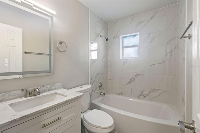 full bathroom with tiled shower / bath combo, vanity, and toilet