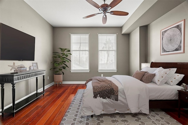 bedroom featuring dark hardwood / wood-style floors and ceiling fan