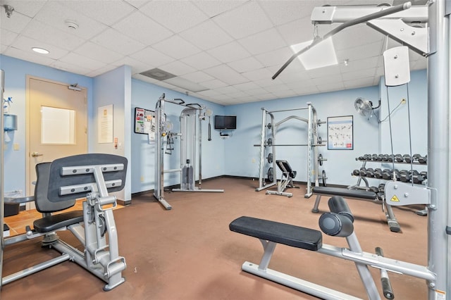 workout area featuring a drop ceiling