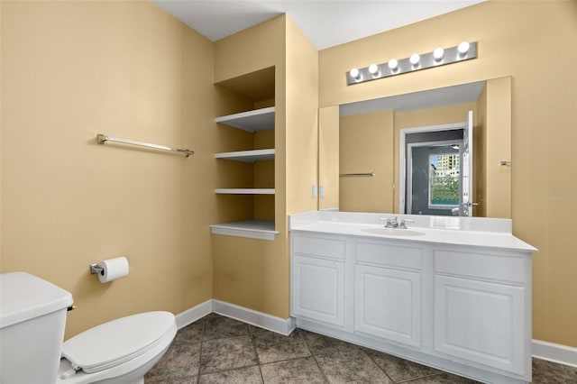 bathroom with vanity, tile patterned flooring, toilet, and built in features