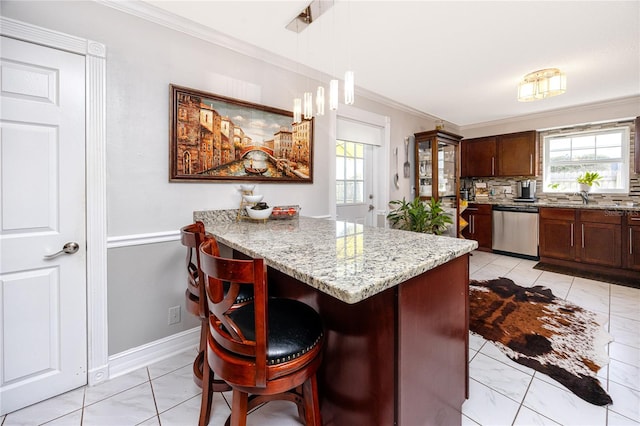 kitchen featuring a kitchen breakfast bar, backsplash, stainless steel dishwasher, ornamental molding, and pendant lighting