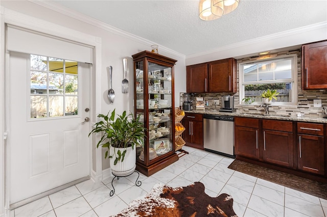 kitchen with light stone countertops, backsplash, stainless steel dishwasher, and sink