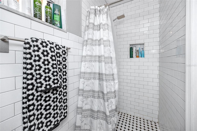 bathroom featuring curtained shower