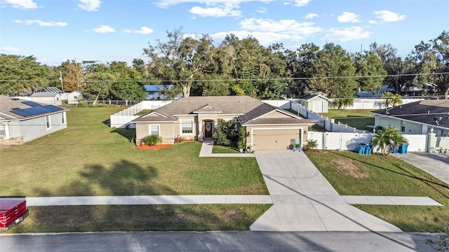 view of front of home with a garage and a front lawn